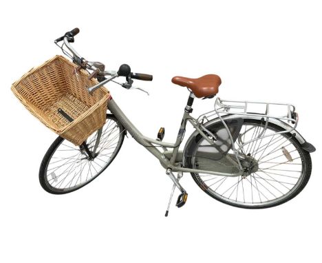 Ladies Raleigh bicycle with front wicker basket and a pair of removable paniers