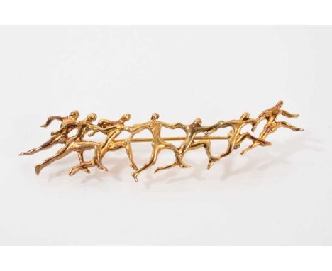 Ilias Lalaounis silver gilt Olympic brooch depicting a line of abstract running figures, 9cm