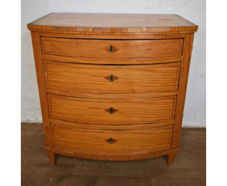 19th century Biedermeier satinwood commode, bowfront outline, with crossbanded top and four long drawers on square tapered le