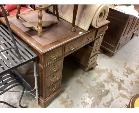 Unusual Georgian oak desk in two parts, the lift-off top with inset writing surface and slides to each side, having nine draw