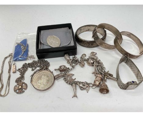 Three silver bangles, silver charm bracelet, Rotary silver wristwatch, etc