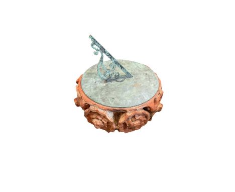 Antique bronze sundial on a terracotta and composite base. Sundial measuring 38cm round.