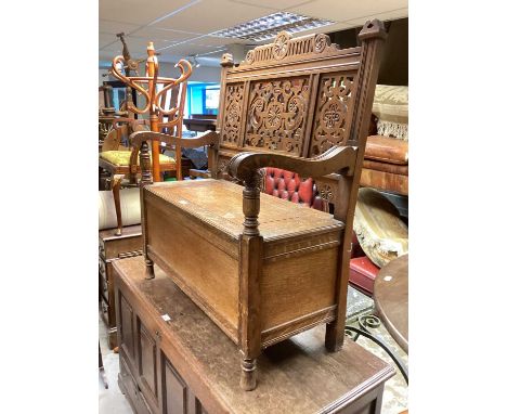 Carved oak hall bench with rising lid to seat, 91cm wide, 45.5cm deep, 107cm high