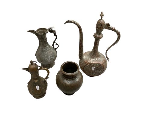 Three Persian metal ewers and a vase, with engraved and relief decoration (4)