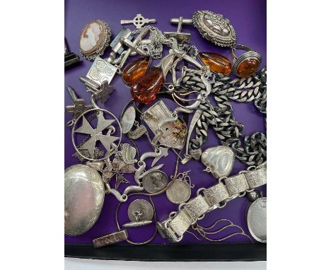 Group of silver and white metal jewellery including amber pendant, pair of earrings and a ring, various chains, lockets, cuff