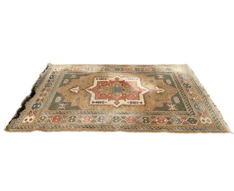 Eastern rug with central medallion on brown, beige, green, red and blue ground, 287cm x 198cm