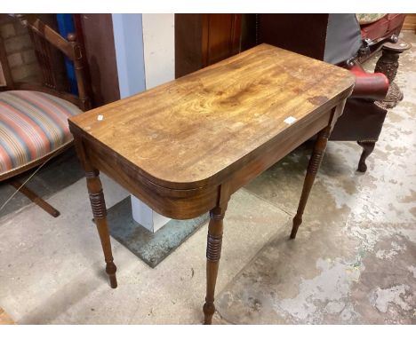 Nineteenth century mahogany card table with foldover top on turned legs, 92cm wide