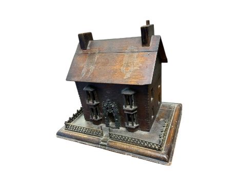 19th century folk art model of a cottage, 36cm wideThe glass is missing from the windows on the front and the roof is also co