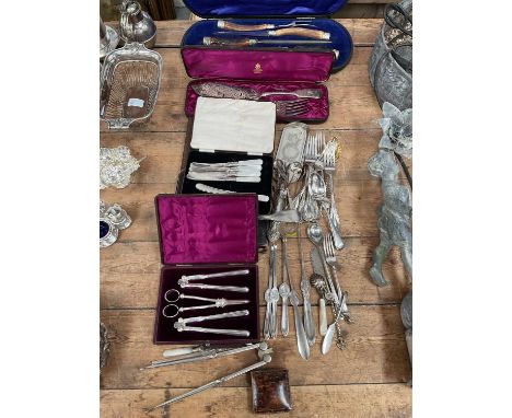 Group of silver plated flatware, including a carving set, lobster picks, etc