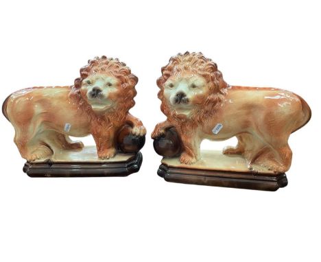 Pair of Staffordshire models of lions