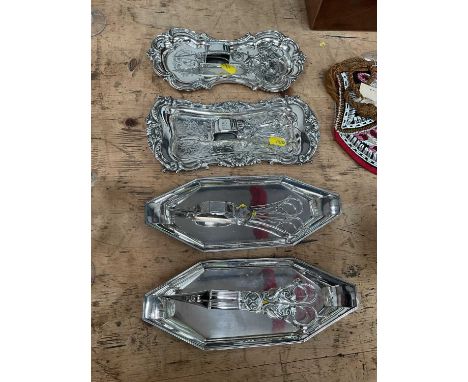 Group of four old Sheffield plate and silver plated candle snuffers and trays