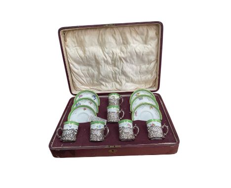 Fitted case of Edwardian silver mounted coffee cans and saucers