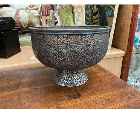 Persian footed metal bowl decorated with Arabic script and foliate patterns, 24.5cm diameter