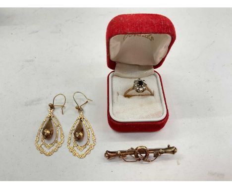 9ct gold gem set dress ring, 9ct gold bar brooch and a pair of yellow metal earrings9ct gold ring and brooch weigh 3.6 grams.