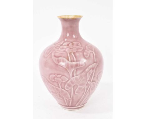 Unusual Oriental porcelain vase, possibly Japanese, relief decorated with flowers on a pink ground, 16.25cm highSmall chip an