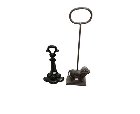 Victorian cast iron door stop together with another door stop in the form of a lion (2).