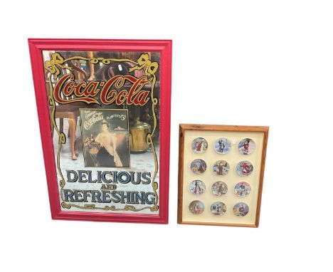 Large Coca Cola framed mirror approximately 96cm x 65cm together with 12 small collector plates in a pine glazed frame