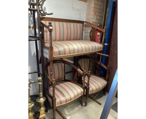 Edwardian inlaid mahogany framed sofa with striped upholstery together with a pair of matching tub chairs
