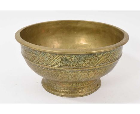 19th century Tibetan bronze bowl, with engraved geometric and foliate ornament, on spread foot, 27cm diameterDescription shou