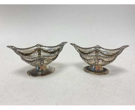Pair of Victorian silver pedestal bonbon dishes of navette form with swag and pierced decoration (London 1895), 16cm wideTota