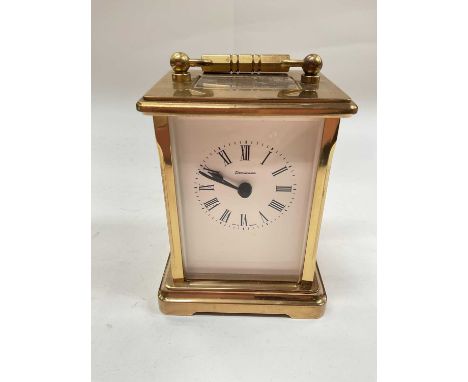 Brass cased carriage clock by Dominion 