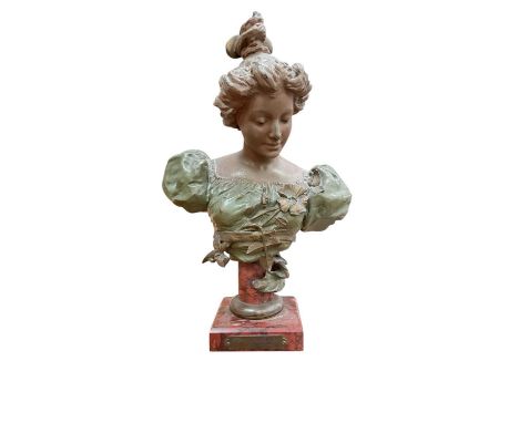 Antique Art Nouveau patinated spelter bust of a woman on a red marble base, with brass plaque reading 'Eglantine / Par H. St 