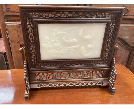 Chinese jade and pierced wood table screen decorated with fish and calligraphyThe jade table screen is in good condition with