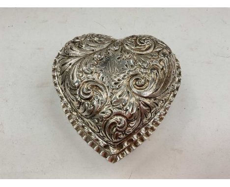 Sterling silver heart shaped jewellery box with embossed foliate scroll decoration, 10.5cm widest point 