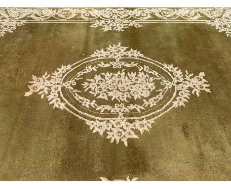 Large Indian rug with central medallion on green and cream ground, 368cm x 279cm