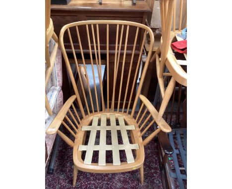 Two Ercol high back elbow chairs and a footstool (3)