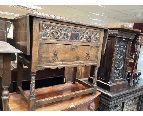 Seventeenth century style oak two drawer chest with drop flaps and painted decoration, 83.5cm wide, 45.5cm deep, 76.5cm high