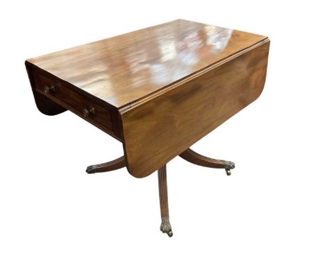 Regency mahogany sofa table, with drop leaf top over end drawer, on reeded cabriole legs and brass paw feet and castors, 91 x