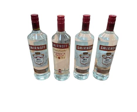 four bottles of Smirnoff Vodka