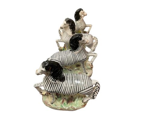 Two pairs of Staffordshire zebras