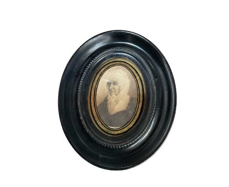 19th century portrait miniature on paper, in verre eglomise oval frame