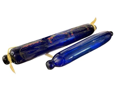 Victorian blue glass rolling pin with motto, 43cm long, and another