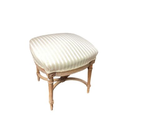 French style limed dressing stool on carved and fluted frame with upholstered seat