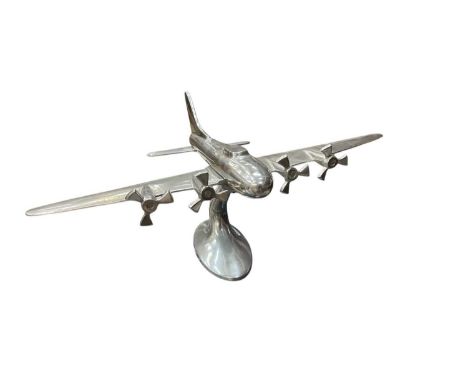 Metal model of a plane measuring approximately 25cm high