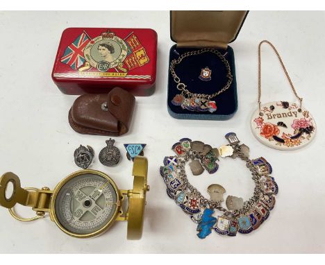 Two silver and enamel souvenir charm bracelets, brass compass and sundry items
