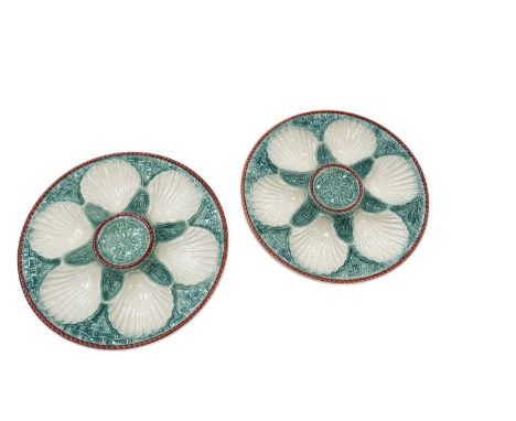 Pair of French majolica oyster plates with basket weave moulding, painted green and cream, 24cm diameter