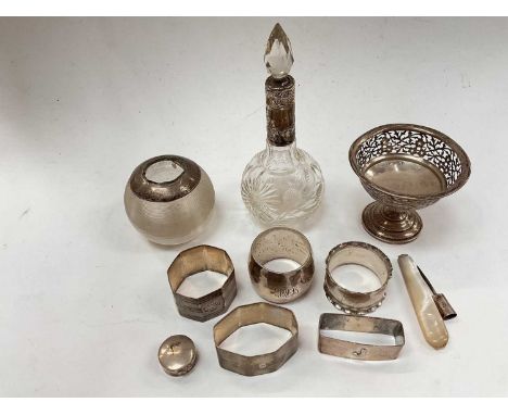 Group of silver to include napkin rings, silver mounted vesta globe, perfume bottle, pierced pedestal dish etc