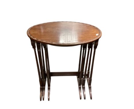 RAF interest- nest of three 1920's mahogany oval occasional tables, with stamped 'AM' Air Ministry marks to undersides.