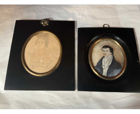 Two 19th century portrait miniatures on paper, in original ebonized frames