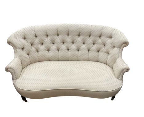 Victorian two seater sofa with buttoned upholstery on turned front legs and brass castors158cm wide x 94cm approximately. 77c