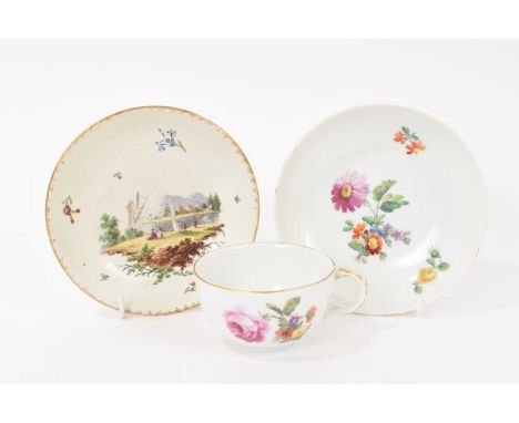 Late 18th/early 19th century Berlin porcelain cup and saucer, painted with flowers, and a Frankenthal saucer (3)