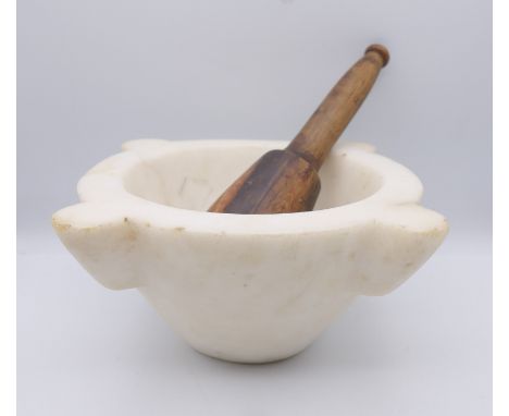 A Victorian white marble mortar and wooden pestle with weighted end.  Pestle 11 cm high, 25.5 cm wide overall, pestle 23 cm h