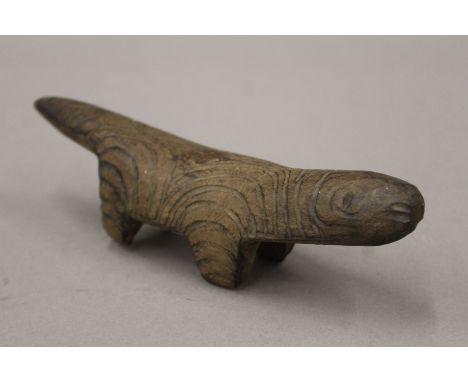 An Aboriginal Australian carved wooden lizard. 18 cm long.