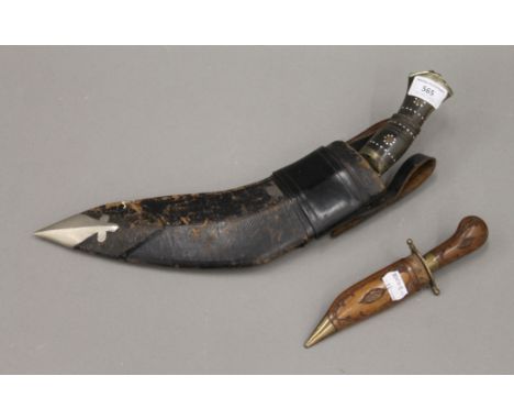 A vintage kukri and an Eastern dagger. The former 42 cm long.NOTE The buyer of this lot must be aged 18 years or over and mus