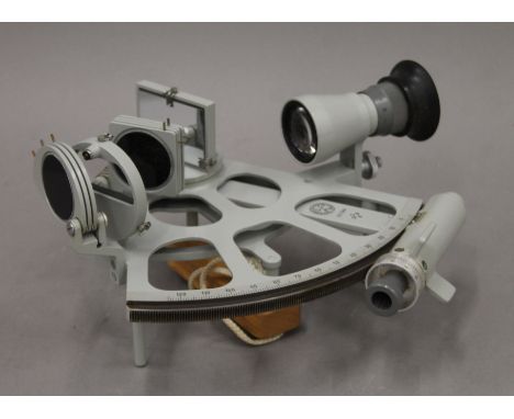 A VEB Freiberger Prazisionsmechanik Trommel-Sextant in its wooden carrying case. The case 33 cm wide.