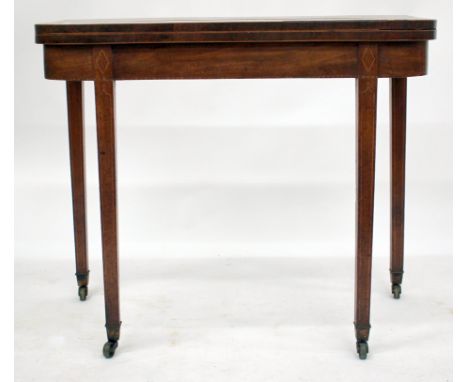 A 19TH CENTURY MAHOGANY FOLD OVER CARD TABLE with square tapering legs and brass casters, 92cm wide together with a Victorian